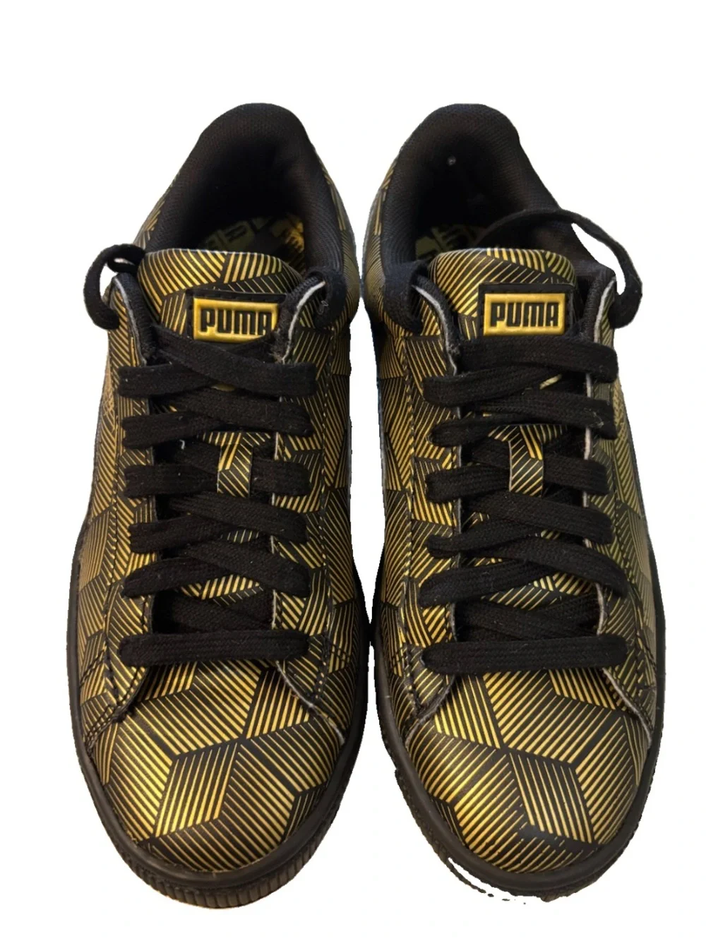 Puma low-top sneaker in black and metallic gold geometric print